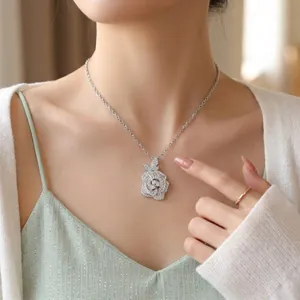 Detailed view of an elegant rose flower pendant necklace encrusted with zircons