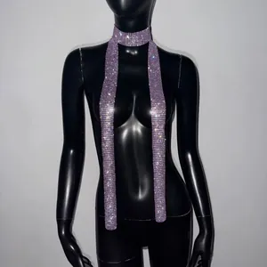 Close-up of a long purple sparkly rhinestone scarf necklace for music festivals on a mannequin