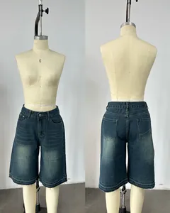 Front and back detail of retro high-waist loose denim bermuda shorts with raw hem