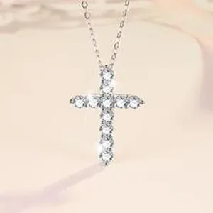 Sparkling Moissanite cross pendant detail on a delicate sterling silver chain