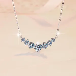 Close-up of D color moissanite curved necklace in s925 silver with starburst sparkle