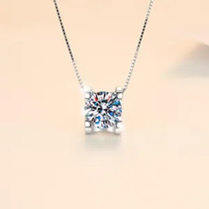 Macro shot of a sparkling 1 carat Moissanite solitaire pendant on a silver chain.
