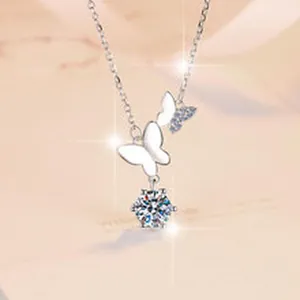 Detailed view of a silver butterfly necklace featuring a sparkling D-color Moissanite