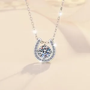 Detailed close-up of a 1ct D color Moissanite horseshoe pendant in s925 silver