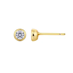 Macro view of gold-plated S925 sterling silver stud earring with a round clear zircon.