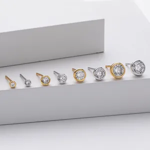 Detailed macro view of S925 sterling silver round zircon stud earrings in various sizes