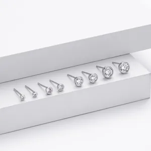 Detailed view of S925 sterling silver bezel-set round CZ stud earrings in various sizes