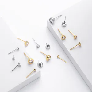 Detailed macro view of S925 sterling silver bezel-set round cubic zirconia stud earrings.