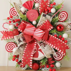 Detailed close-up of a festive Christmas wreath with red ribbons and candy ornaments