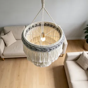 Detailed top-down view of a handmade Bohemian macrame lampshade featuring tiered tassels