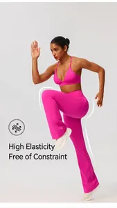 Close-up of vibrant pink flared yoga pants on model in dynamic running pose, quick-dry fabric.
