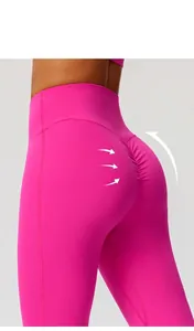 Detail view of hot pink high-waisted scrunch butt yoga leggings with lifting effect