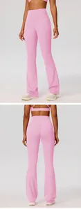 Detailed macro view of pink flared yoga pants featuring high waist and booty lift design