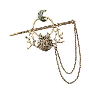 Vintage wolf head hair stick with crescent moon and hanging chains on white background