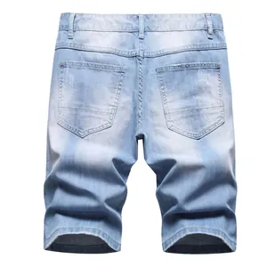 Back view of summer light blue distressed denim cotton casual shorts for men on white.