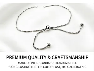 Detailed view of adjustable titanium steel box chain bracelet on silk background