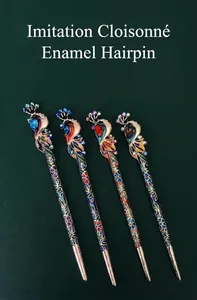 Detailed view of four vintage peacock hairpins with colorful enamel and rhinestones.