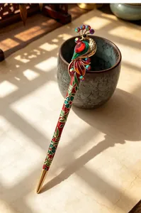 Detail view of a vintage Chinese style peacock hairpin with colorful rhinestones.