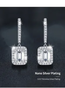 Detailed view of radiant cut moissanite earrings in 925 silver with halo design