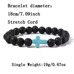 Detailed view of 8mm black lava stone beaded bracelet featuring a blue turquoise cross charm