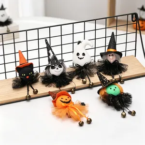 Detailed view of Halloween cartoon plush hanging ornaments with bells and tulle skirts