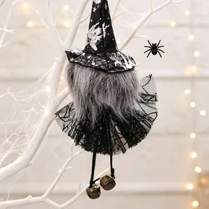 Detailed view of Halloween witch gnome hanging decoration with black lace skirt and bells