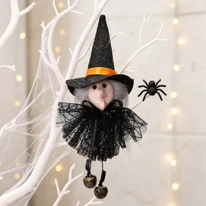 Close-up detail of Halloween witch hanging ornament with lace dress and small bells