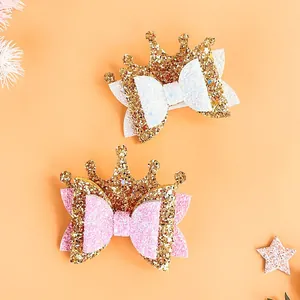 Detailed view of princess glitter crown hair clips with sequin bows for children's hair.