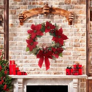 Large red poinsettia Christmas wreath with ribbon bow for holiday home decoration