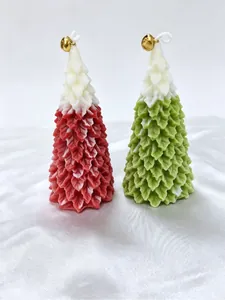 Close-up detail of red and green snowy Christmas tree scented candles with bells