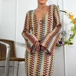 Close-up detail of the V-neck crochet dress featuring a chic wave pattern and gold ring