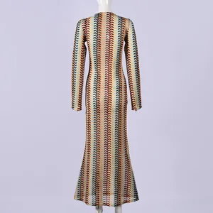 Back view of a long-sleeved slim-fit maxi dress with colorful zig-zag knit pattern.