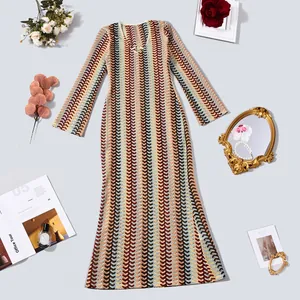Close-up of elegant V-neck long sleeve knit maxi dress with colorful wave pattern
