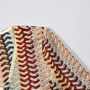 Close-up detail of multi-colored wavy knit pattern on a slim V-neck dress.