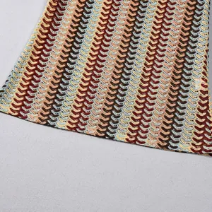 Detailed macro view of the multi-colored chevron crochet knit texture on this dress