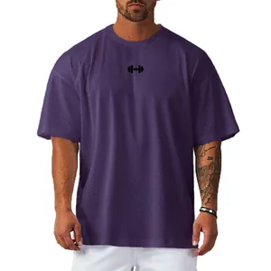 Close-up of breathable purple mesh fabric texture on men's oversized fitness T-shirt