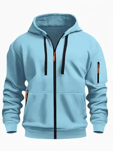 Close-up detail of a light blue men's zip-up hoodie with orange zipper accents.