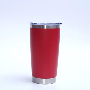 Detailed macro view of a 20oz red insulated stainless steel tumbler with clear lid