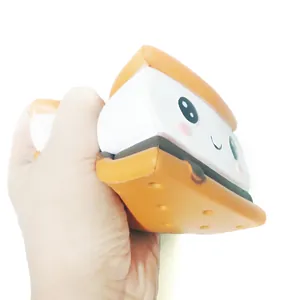 Cute s'more shaped slow rebound squishy stress relief toy being squeezed by hand.