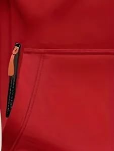 Close-up of the zipper pocket detail on a vibrant red men's hoodie jacket.