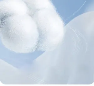Close-up macro view of natural cotton boll fiber showing soft and breathable texture