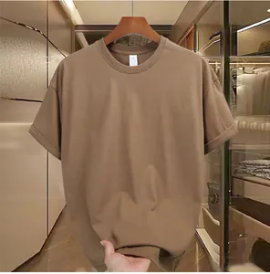 Close-up detail of a brown men's loose fit heavy cotton t-shirt for summer wear