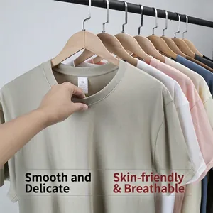Premium soft and breathable men's loose short-sleeved cotton T-shirt on wooden hangers.