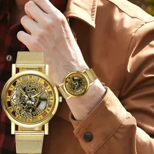 Close-up of men's gold skeleton quartz watch with mesh strap and Roman numerals