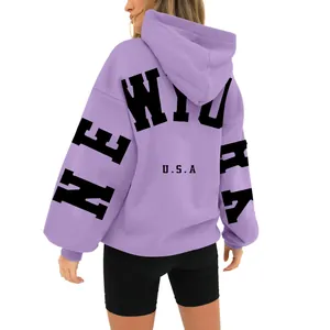 Back view of oversized lavender hoodie featuring bold New York USA letter print