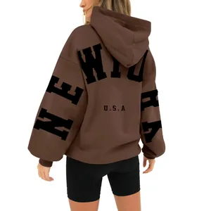 Back view of brown fleece hoodie with black New York USA letter print