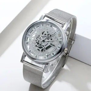 Close-up detail of silver skeleton quartz watch with mesh strap and Roman numerals