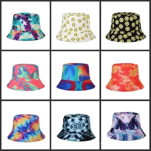 Assorted colorful tie-dye and iconic smiley face pattern bucket hats for summer