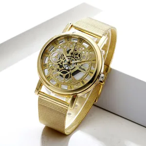 Detailed view of luxury gold skeleton dial quartz watch with metallic mesh strap