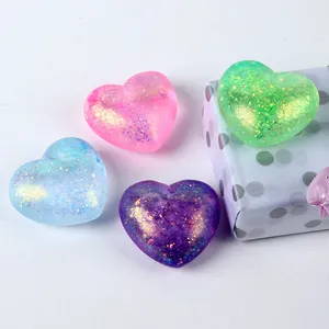Detailed macro shot of various glittery heart-shaped slow rebound stress relief toys